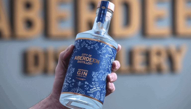 Image: Hand holding a City of Aberdeen Distillery gin bottle